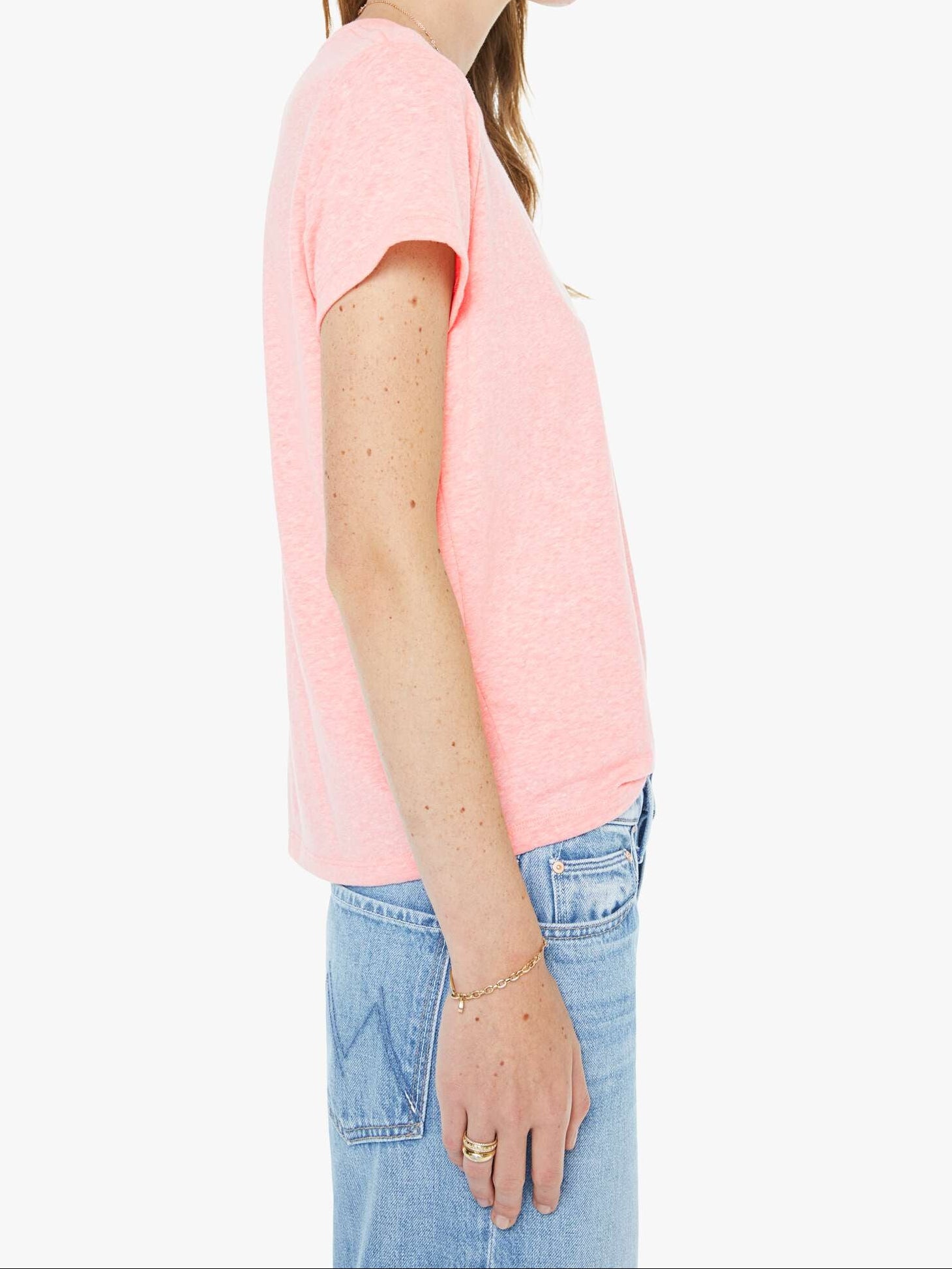 Woman wearing a pink t-shirt and sunglasses on a white background