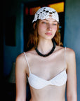 Montego Necklace front view on model in crochet top