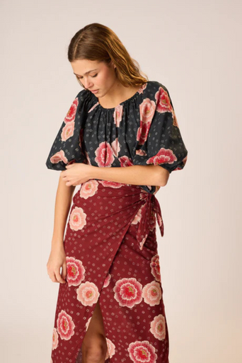 Natalie Martin Ella Top Poppy Print worn on shoulders