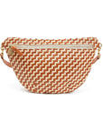 A woven fanny pack featuring a terracotta orange and cream zigzag pattern, with a top zipper and a tan leather strap on a white background.