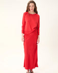 Woman wearing a red outfit on a white background