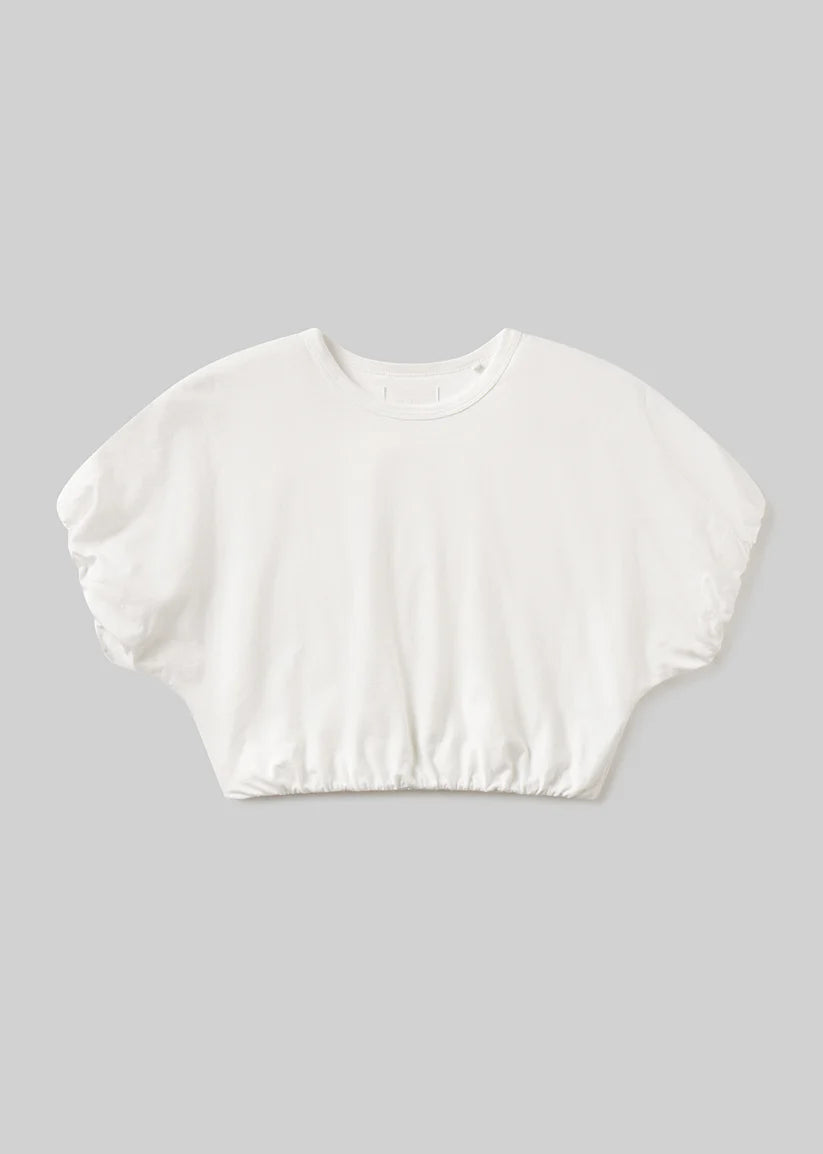 White crop top on a gray background