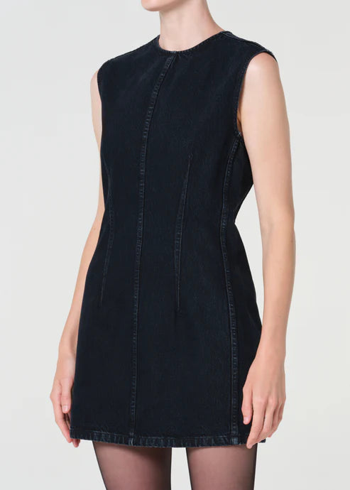 Black sleeveless dress worn by a model on a white background
