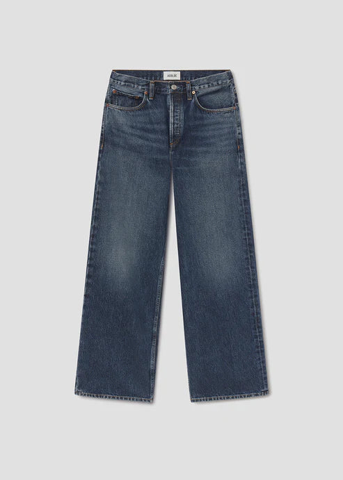Pair of blue jeans on a light gray background
