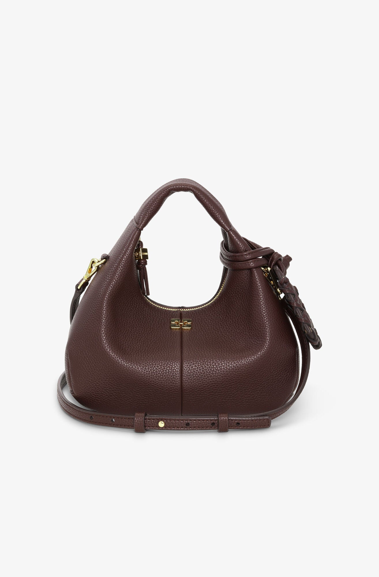 Brown leather handbag with gold accents on a white background