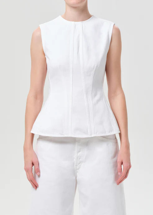 model wearing white denim top with a white background