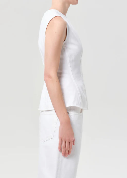model wearing white denim top with a white background