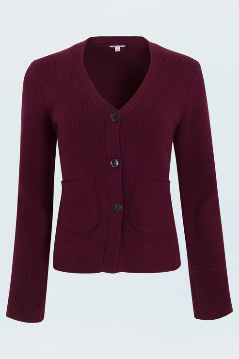 Woman wearing a burgundy cardigan on a white background