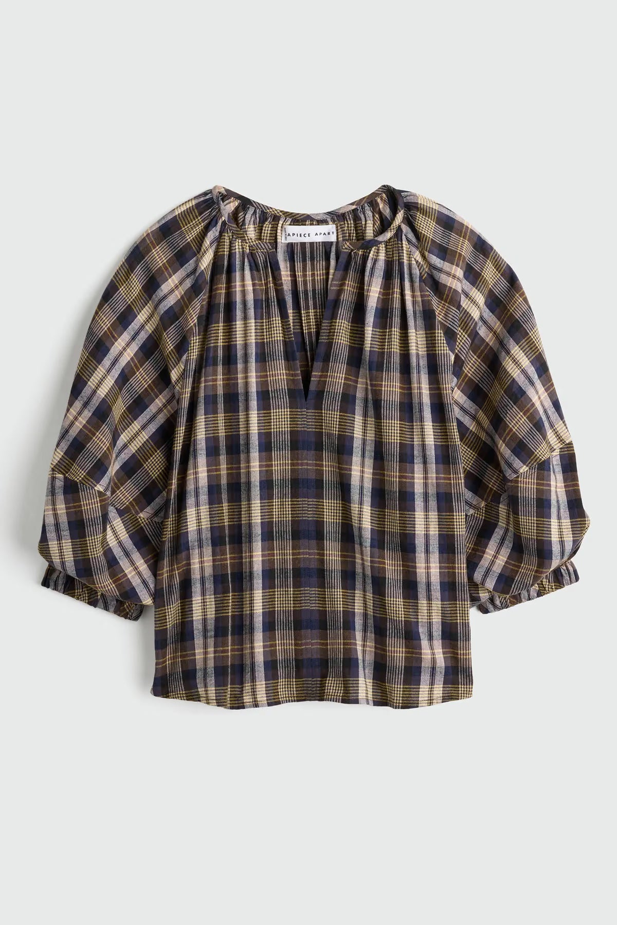 plaid vneck short sleeve top on a grey background 