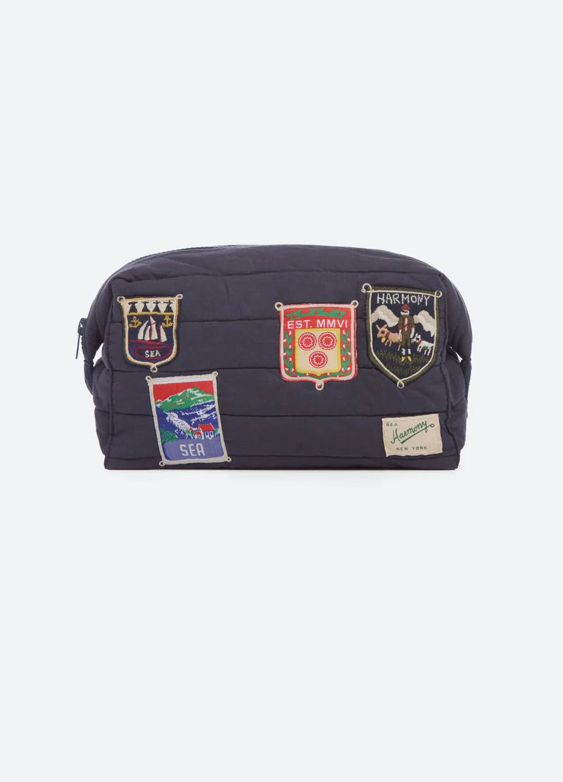 Navy blue bag with patches on a white background