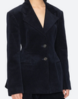 Navy blue blazer worn by a model on a white background