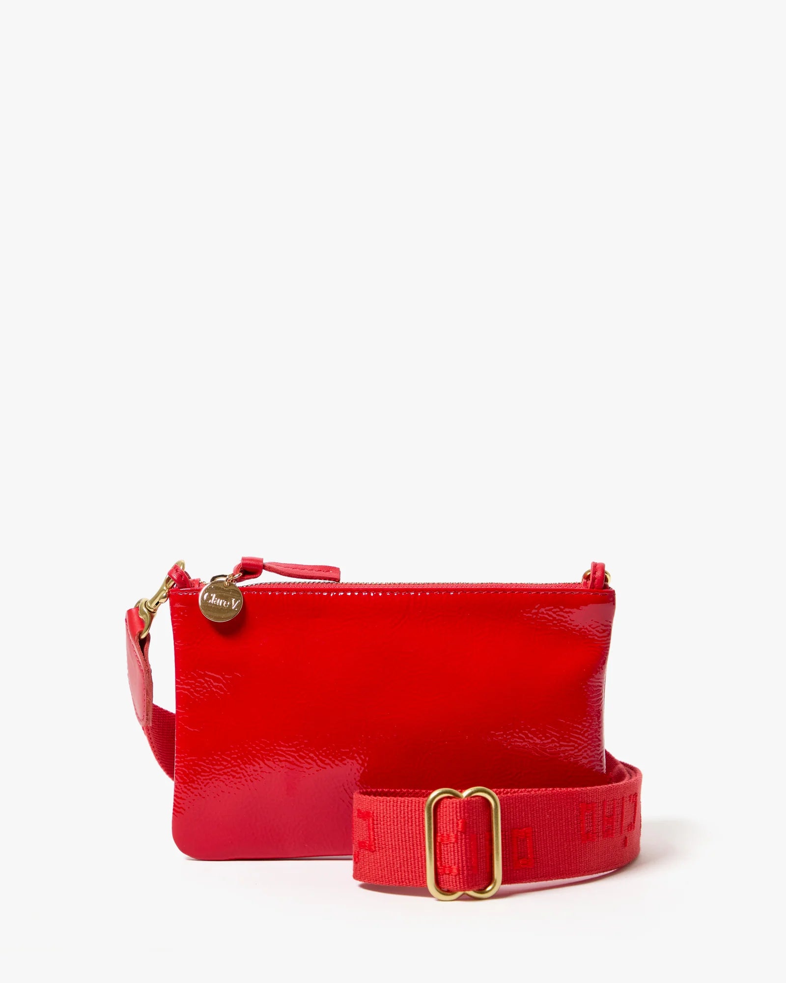 Red handbag with a strap on a white background