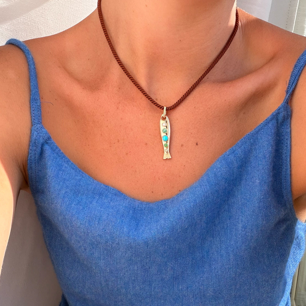 Amalfi Fish Clip Charm on model attached to silk chord necklace