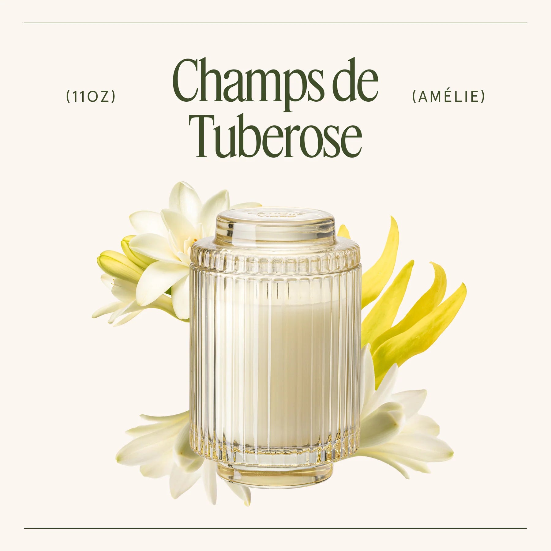 Candle labeled 'Champs de Tuberose' with tuberose flowers on a white background