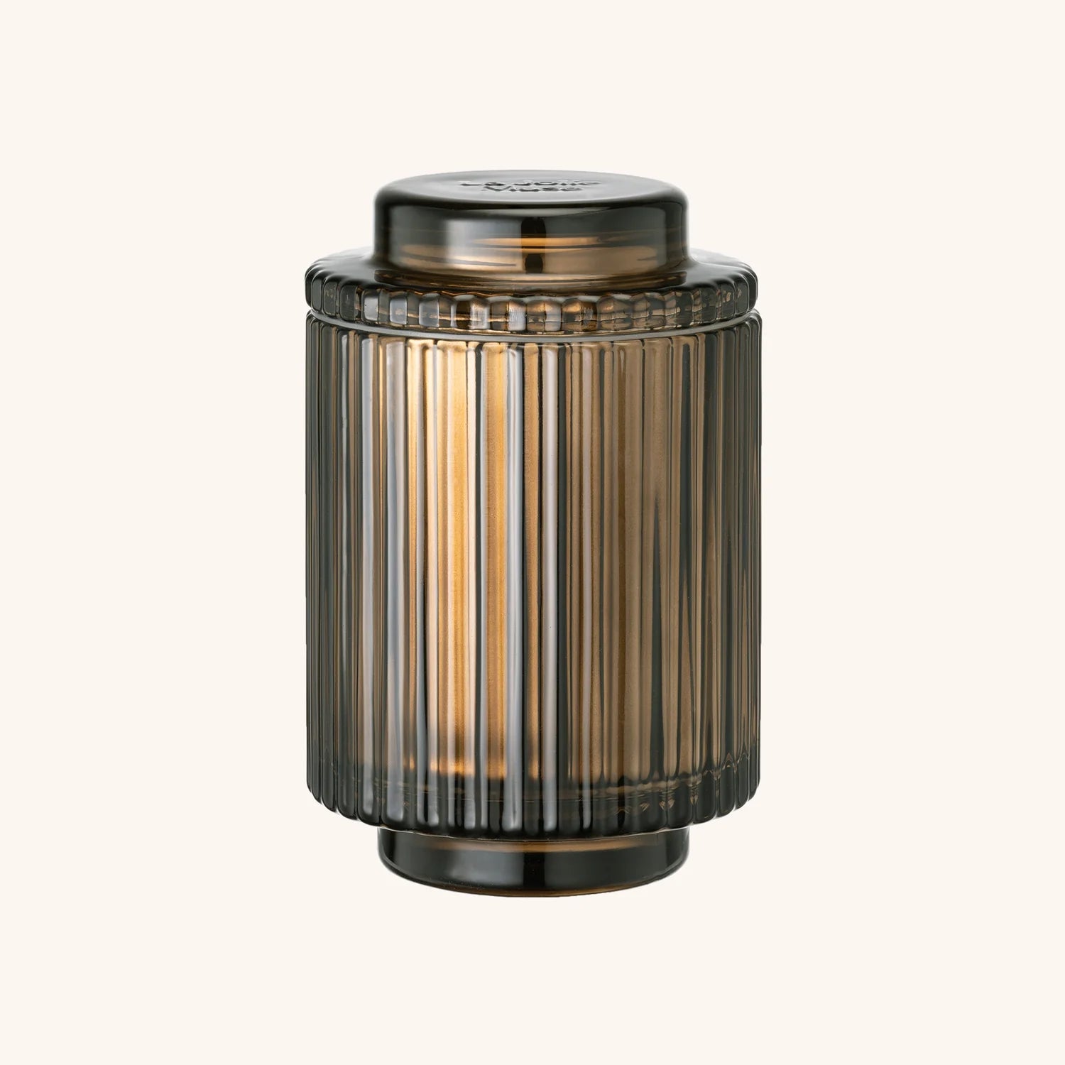 Decorative cylindrical lantern with ribbed design on a white background