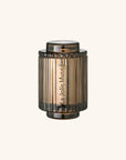 Bronze-colored cylindrical object with 'La Jolie Muse' branding on a white background