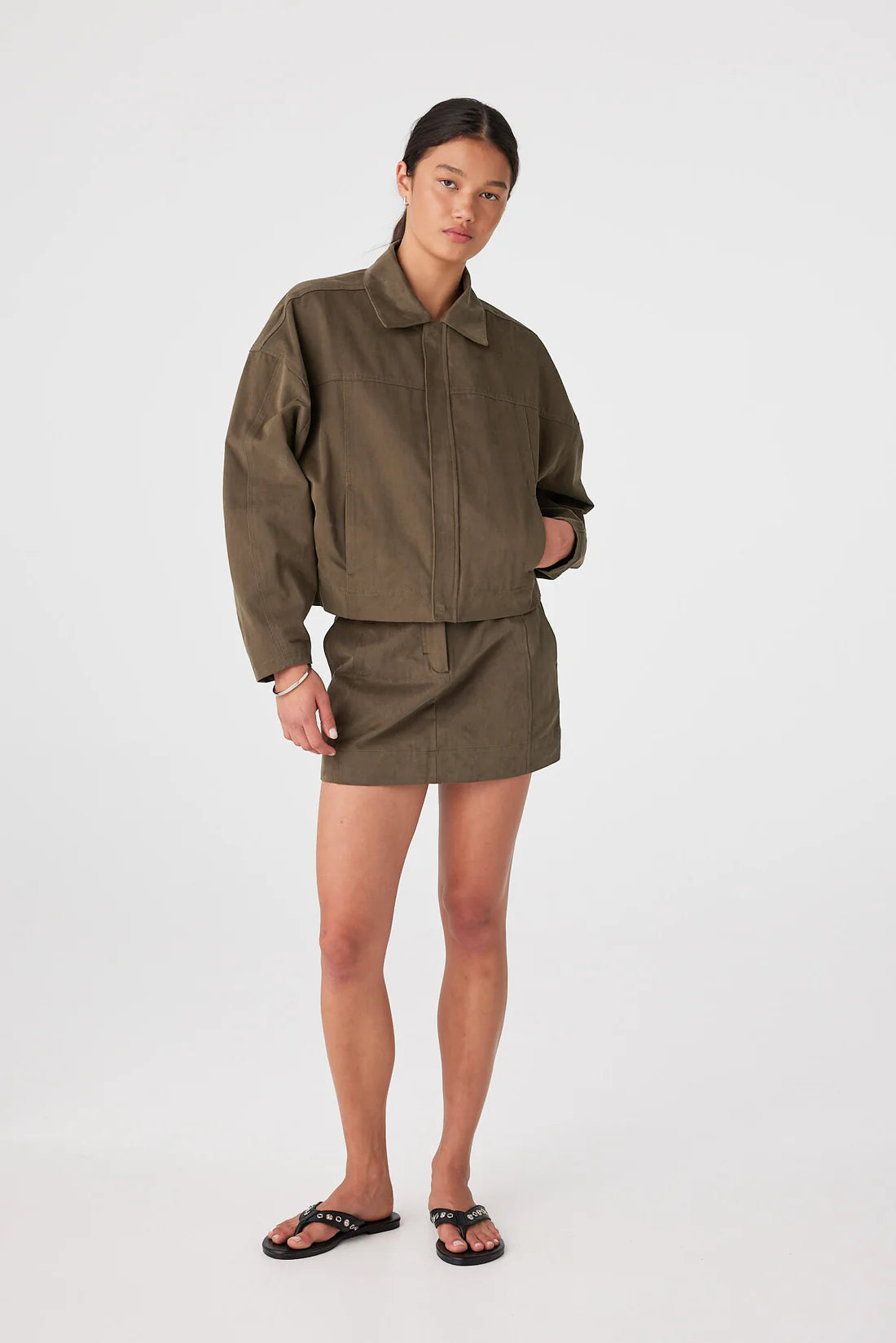 Eames Mini Skirt full body front with zipped up jacket