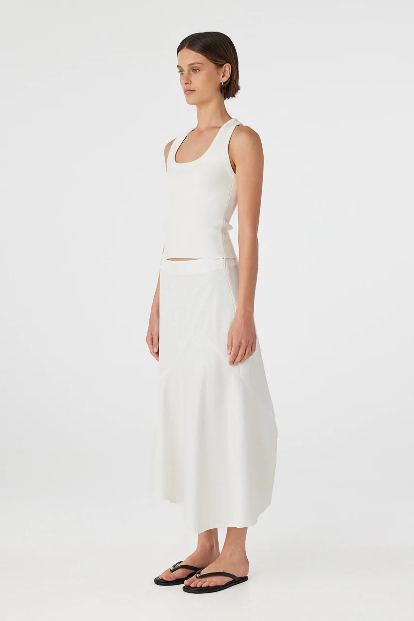 Woman wearing a white dress on a white background