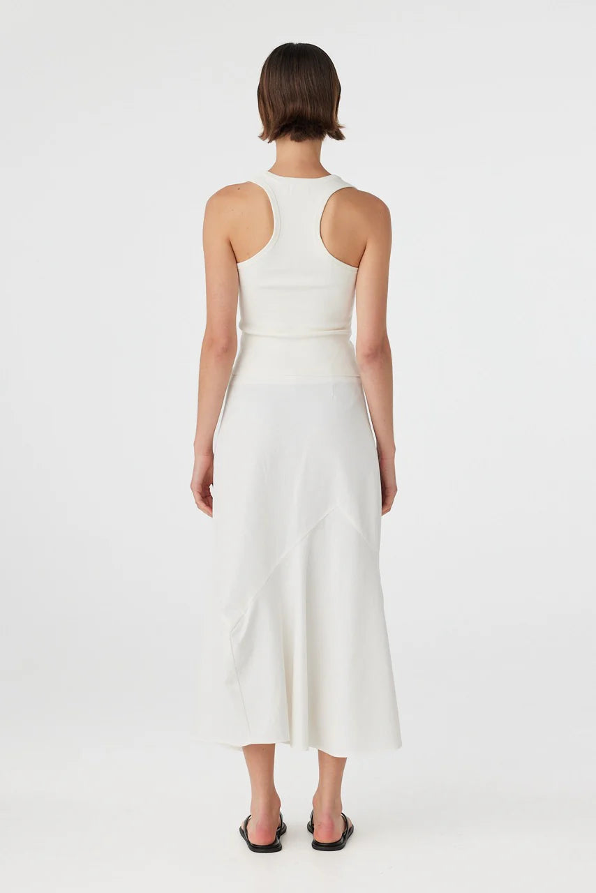 Woman wearing a white dress on a white background