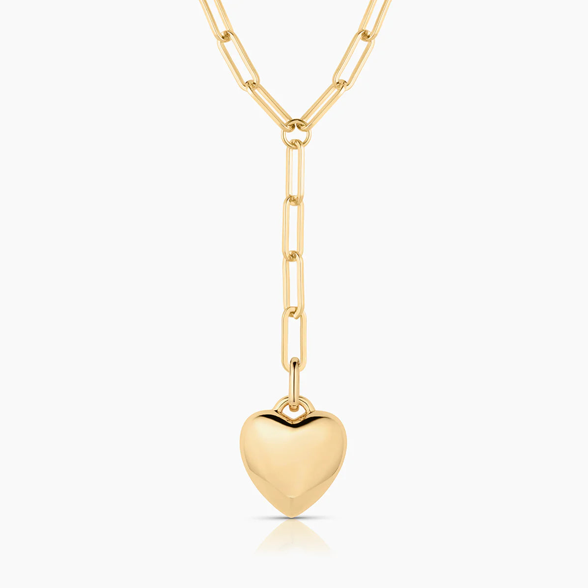 Gold heart-shaped pendant on a gold chain against a white background