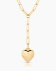 Gold heart-shaped pendant on a gold chain against a white background