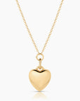 Gold heart-shaped pendant necklace on a white background