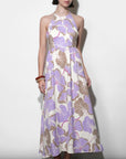 Woman wearing a floral dress with a white background
