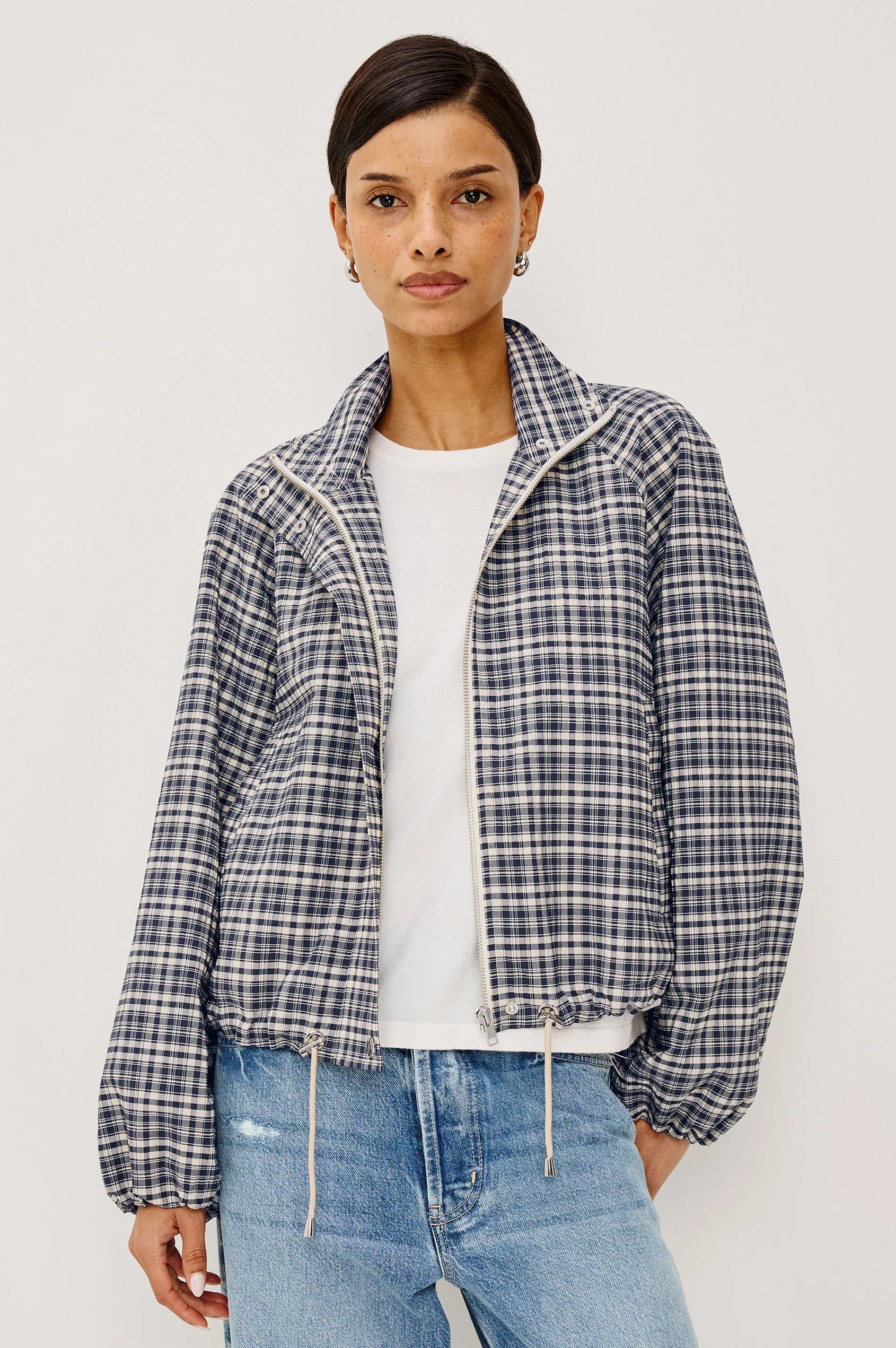 model wearing a white tshirt with the mini check blake jacket over with jeans on a white background