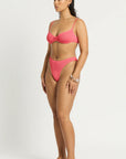 Model size M wearing Gracie Balconette in Coral Pink, side