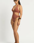Model size M wearing Celeste One Piece in Fawn Shimmer, side