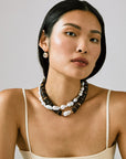 Bilbao II Collar Necklace layered with freshwater pearl necklace