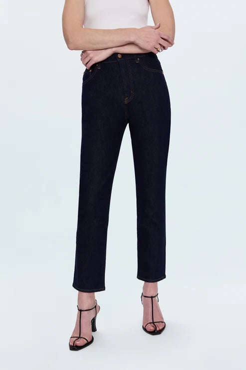 Person wearing black jeans on a white background