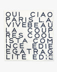 a white scarf with navy blue graphic lettering, photographed against a solid white background