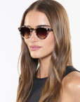 Barrett Amalfi Sunglasses on  model with wide, heart face shape