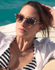Barrett Amalfi Sunglasses on model in a pool with average square face shape