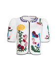 White shirt with colorful floral embroidery on a white background