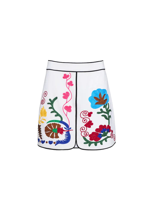 White shorts with colorful floral and abstract designs on a white background