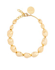 Gold beaded bracelet on a white background
