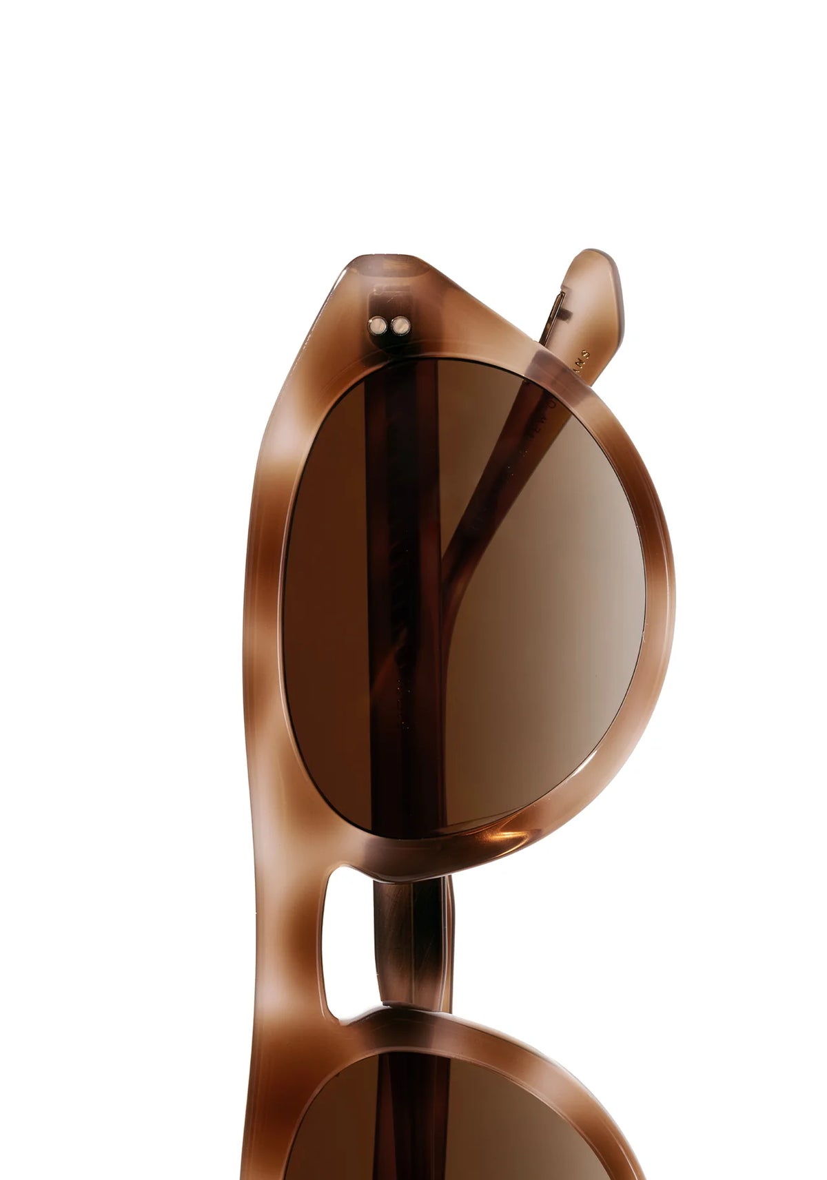Close-up of a pair of sunglasses with a translucent brown acetate frame and dark brown lenses, shown against a solid white background.