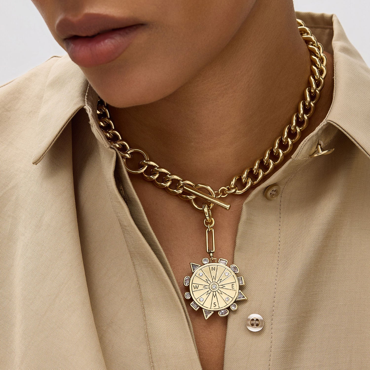 Odyssey Necklace in Baby Blue front view on model showing compass side