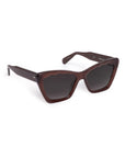 Cat-eye sunglasses with a glossy brown frame and dark gray lenses, shown on a light gray background.