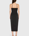 Black strap dress worn by a model on a white background
