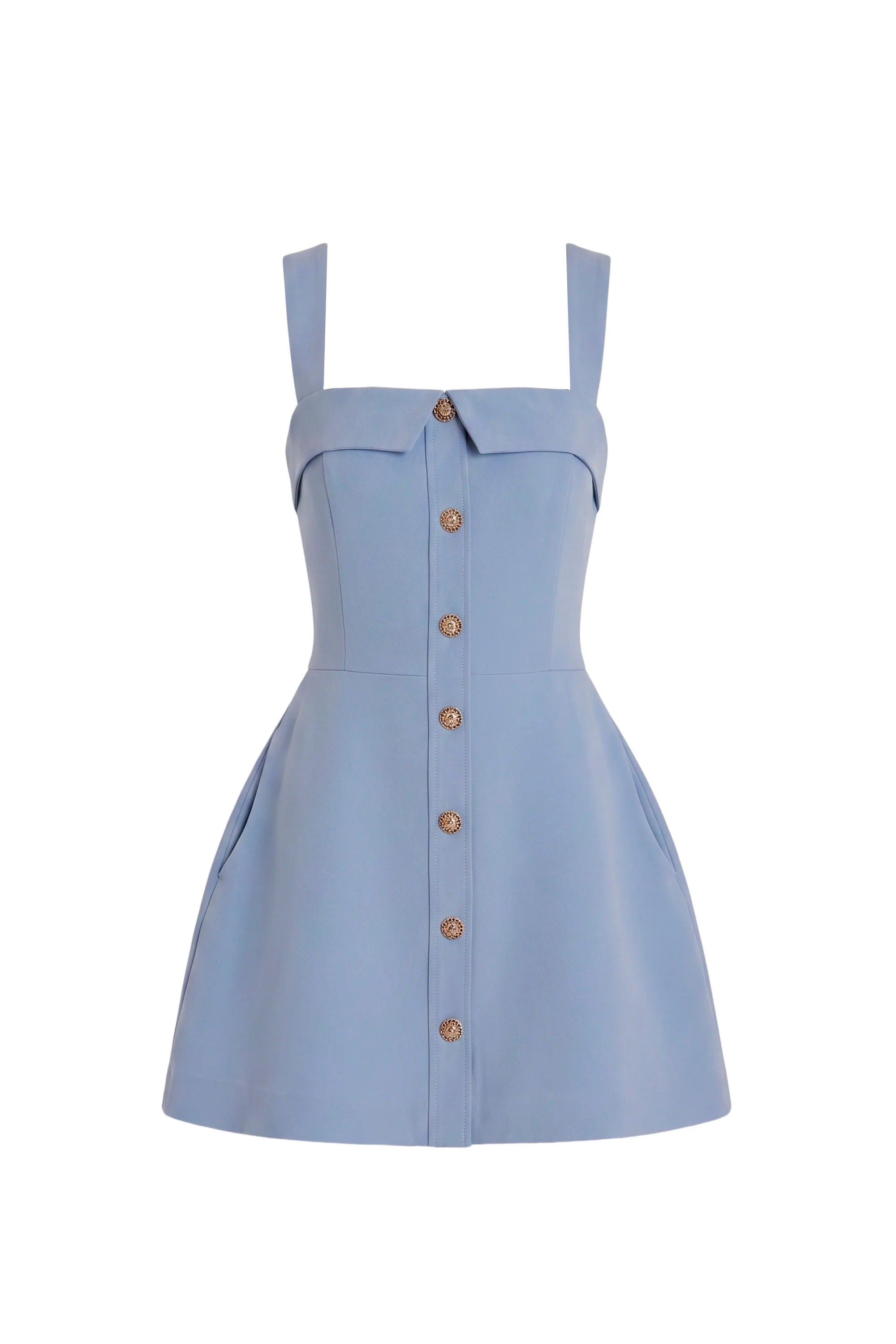 A light blue sleeveless mini dress with a structured, slightly flared silhouette, square straps, a pointed collar detail at the bust, and a central button-down front with gold-tone buttons.