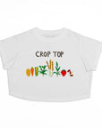 A white cropped short-sleeve baby t-shirt featuring a graphic print of various vegetables and the text 'CROP TOP' in brown lettering.