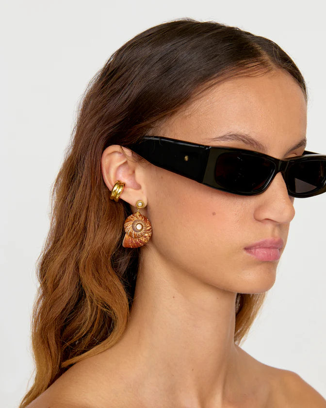 Caracol Earrings right side view on model