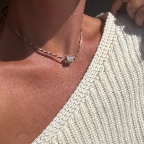 Coco Sand Silk Cord Necklace on model with charm in center