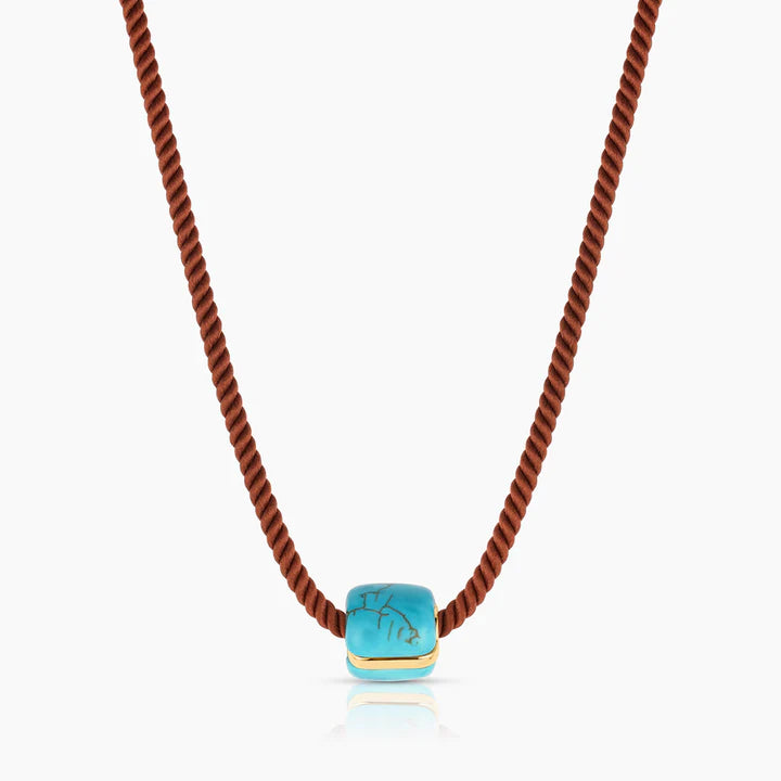 Necklace with a turquoise pendant on a white background