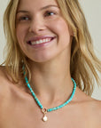 model wearing charm enhancer turquoise gemstone necklace 
