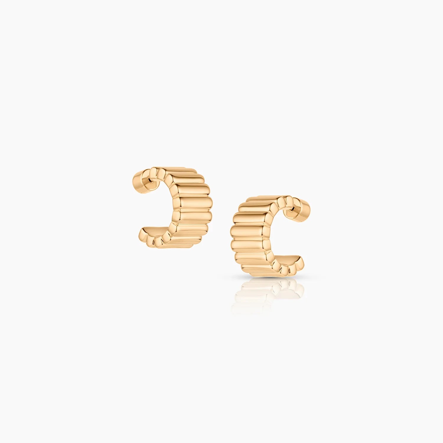 Gold hoop earrings on a white background