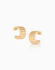 Gold hoop earrings on a white background